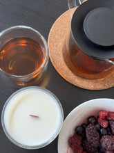 Load image into Gallery viewer, Wooden wick candle next to a glass of tea, bowl of mixed berries and a teapot.