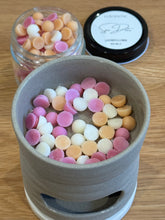 Load image into Gallery viewer, Colorful candy buttons in a small container on a wooden surface