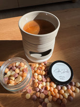 Load image into Gallery viewer, Cup of coffee with a smiley face, jar of candies, and container of coffee beans on a wooden surface.