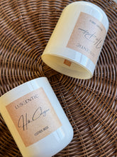Load image into Gallery viewer, Two candles in white containers with wooden wicks. His Cologne candle and Her Perfume candle.
