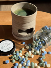 Load image into Gallery viewer, Ceramic mug with a green and black interior, surrounded by colorful round candies on a wooden surface.
