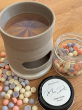 Load image into Gallery viewer, Ceramic cup with a drink, jar of candies, and container labeled 'Luscentic More Date' on a wooden surface.
